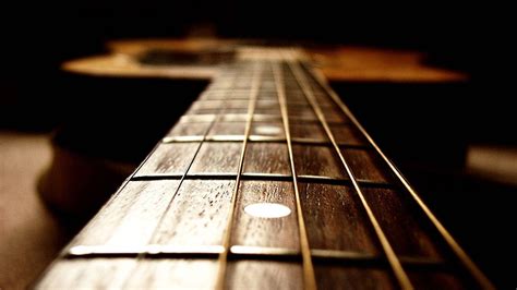 Download "A Close-up of a Guitar Fretboard" Wallpaper | Wallpapers.com