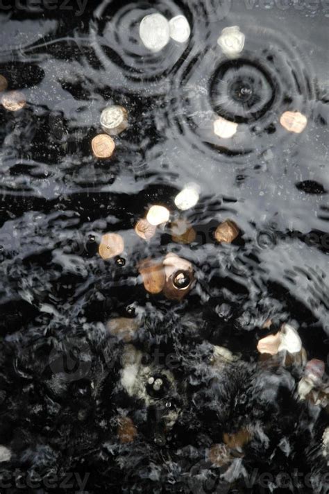 Wishing Well Coins & Ripples 909120 Stock Photo at Vecteezy