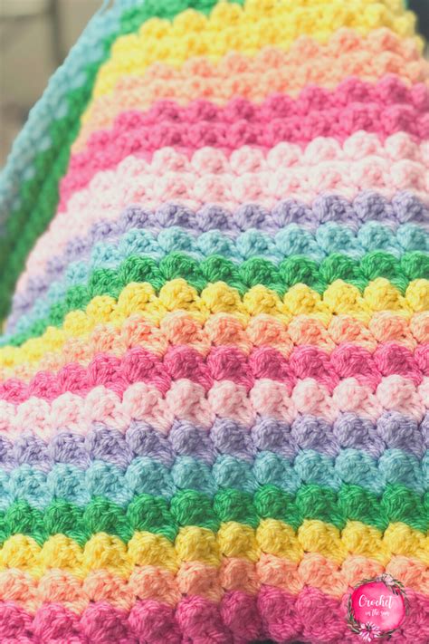 Rainbow crochet blanket pattern that is free, easy, and beginner friendly