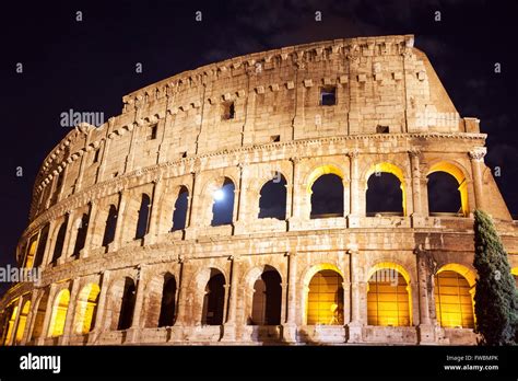 Colosseum at night with the full moon Stock Photo - Alamy