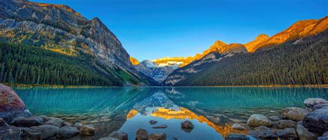 A Panoramic View of Sunrise at Lake Louise, Banff National Park, Canada ...