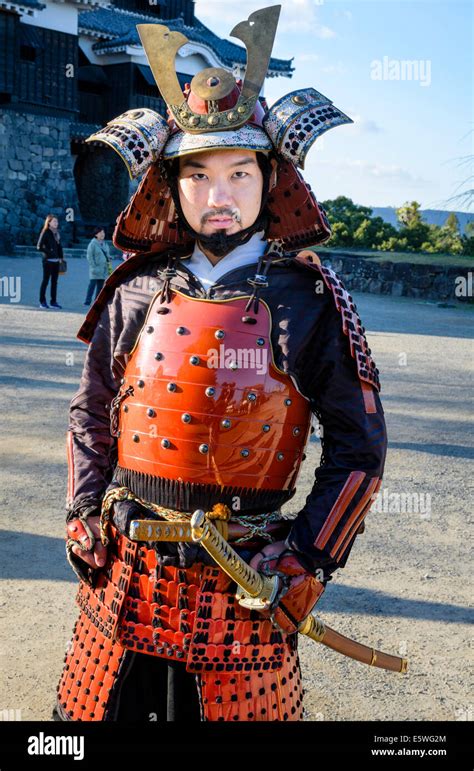 Japanese man wearing traditional samurai armour / armor, including ...