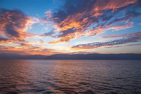 Body of Water Under Cloudy Sky during Daytime · Free Stock Photo