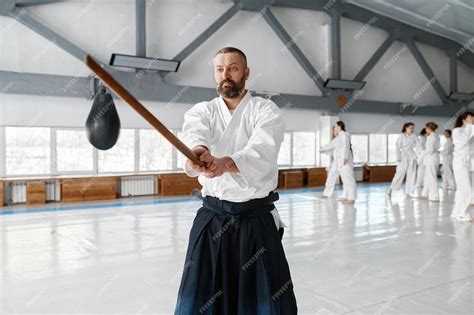 Premium Photo | Portrait of aikido sensei master with wooden sword at ...