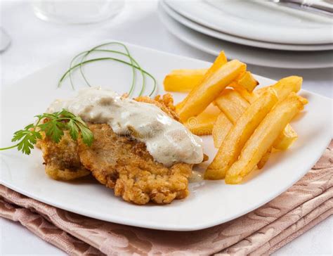 Schnitzel with Cheese Sauce Stock Photo - Image of chicken, beer: 81342080