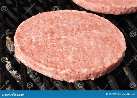 Frozen Hamburger Patties On The Grill Stock Photos - Image: 13576993