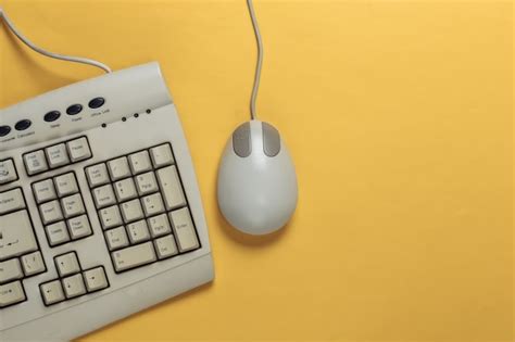 Premium Photo | Old-fashioned retro keyboard and pc mouse on yellow ...