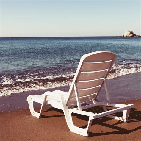 Beach chairs on the beach stock photo. Image of blue - 38698458