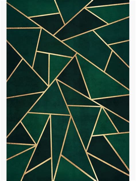 a green rug with gold lines and triangles on it's surface, in the ...