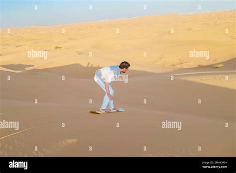 Dubai desert safari sandboard hi-res stock photography and images - Alamy