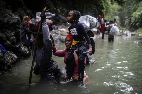 Migrants crossing dense Darien jungle at…