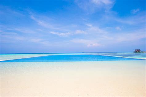 Infinity swimming pool at a tropical beach 1738860 Stock Photo at Vecteezy