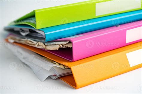 File Folder Binder stack of multi color on table in business office ...