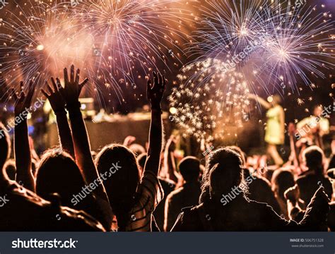 New Year Concept - Cheering Crowd And Fireworks Stock Photo 506751328 ...