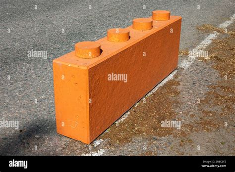 Orange lego-shaped concrete Jersey barrier at Strandallèn in Tammisaari ...