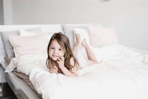 Charming Little Girl Lying On Bed by Alina Hvostikova | Girls in bed ...