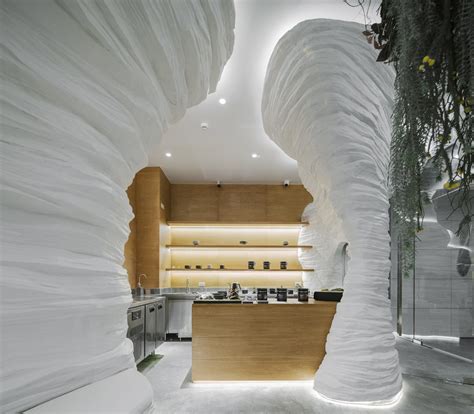 Immerse in the luscious waves of white cave design at KSANA Tea House ...