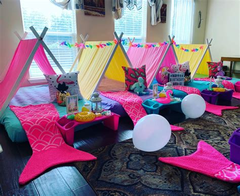 a room filled with lots of colorful tents and pillows on top of a ...