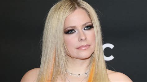 Avril Lavigne puts on very cheeky display in daring outfit that divides ...