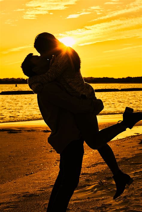 Engaged couple kiss at golden sunset on the beach | Beach pictures ...