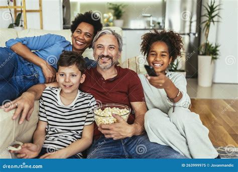 Family Watching TV Together at Home and Having Fun Together Stock Image ...