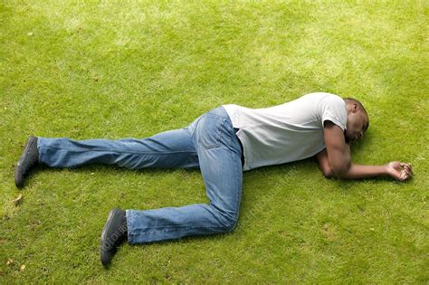 Man in recovery position - Stock Image - F004/0696 - Science Photo Library