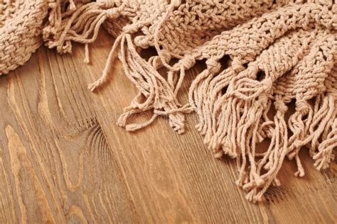 Brown Knitted Blanket on Wooden Background Stock Photo - Image of knit ...