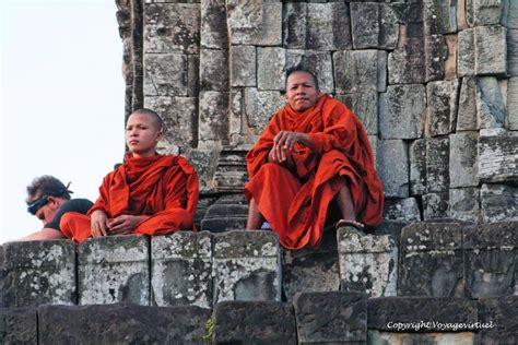 The men in red Phnom Bakheng, Angkor, Cambodia