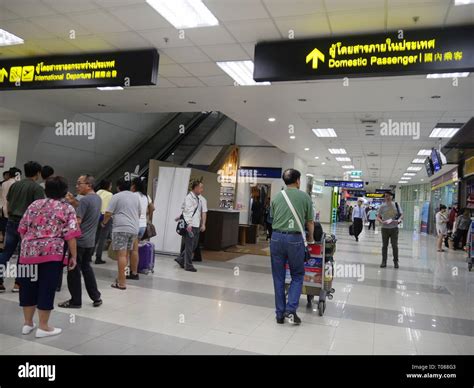 CHIANG MAI, THAILAND —MARCH 2018: Passengers head to the domestic and ...