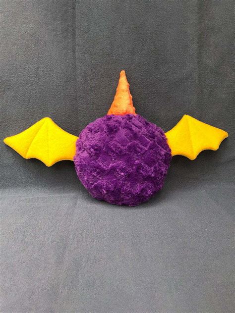 Mellow, the purple people eater plush monster