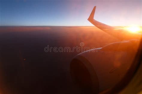 Sunset sky on airplane, plane window.view through sunset window of an ...