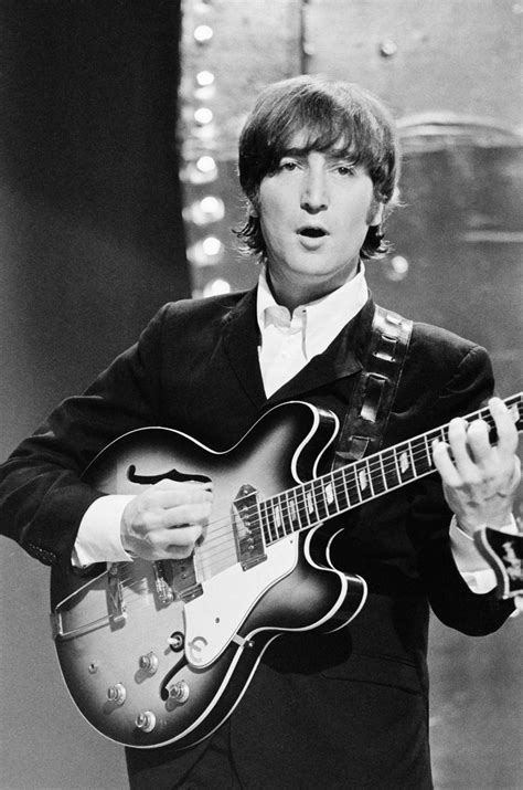 John Lennon from The Beatles performs 'Rain' and 'Paperback Writer' on ...