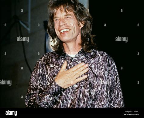 Jagger, Mick, * 26.7.1943, British musician, portrait, receiving the ...