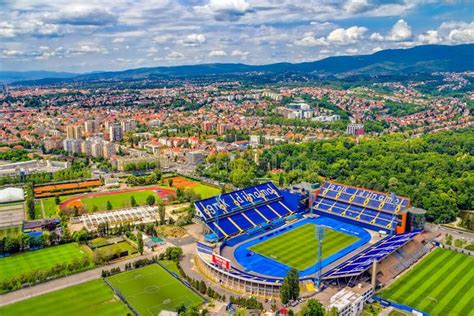 an aerial view of a soccer stadium in the middle of a city with ...