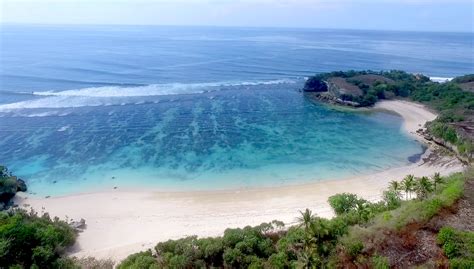 beaches in sumba - beautiful clear preserved ocean in sumba surf camp