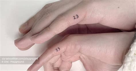 Matching tattoo of the number "23" for couple.