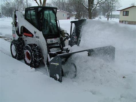 Snow blowers accommodate skid steers, tractors - Turf & Rec