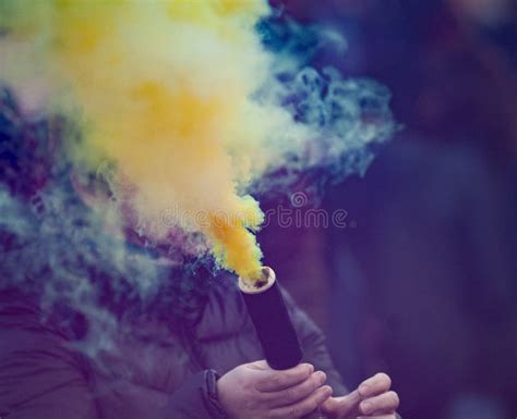 Colorful yellow smoke bomb stock image. Image of vivid - 153833967