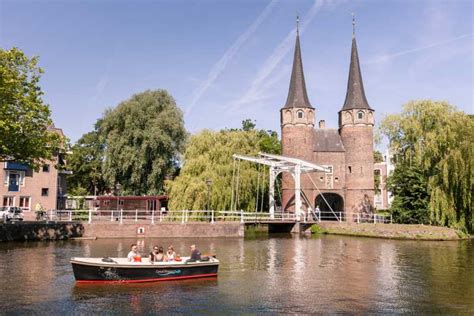 Delft: Open Boat Canal Cruise with Skipper | GetYourGuide