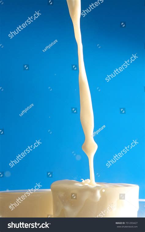 Milk Splash Blue Background Stock Photo 751293427 | Shutterstock