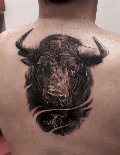 a man with a bull tattoo on his back