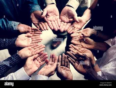 Group of diverse hands in a circle Stock Photo - Alamy