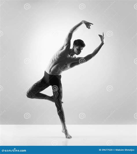 A Young And Fit Male Ballet Dancer Posing In A Studio Stock Photo ...