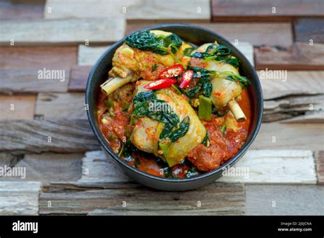 Indonesian Spicy basil chicken Ayam Woku Stock Photo - Alamy