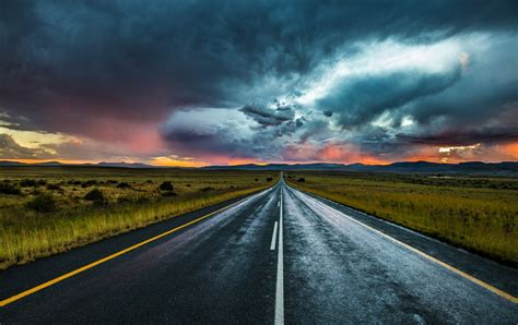 Stunning Landscapes: 4K Ultra HD Road Under Dramatic Clouds