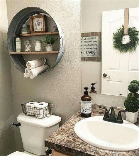 Galvanized wash tub shelf idea over the toilet. Black wire basket to ...