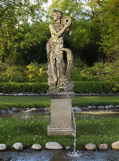 A CARVED LIMESTONE FOUNTAIN FIGURE REPRESENTING SALACIA (GODDESS OF THE ...