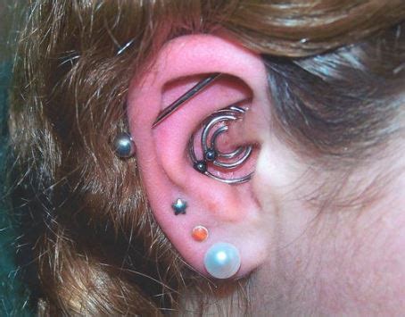 Daith Piercing Pain Scale, Cost, Infection, Pictures, Bump, Cleaning ...