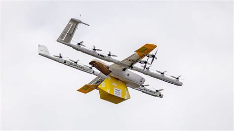 Take a Look at Wing's Auto-Loading Drone Delivery System - CNET