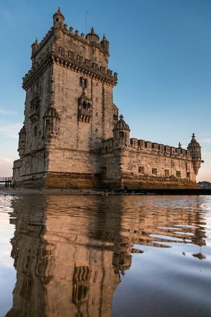 Premium Photo | Belem tower in autumn at sunset